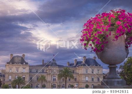 Luxembourg gardens with flowers vase and dramatic sky, Paris, France 93942631