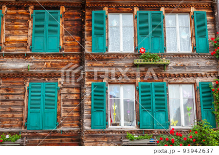 Wooden rustic swiss chalet facade in Interlaken, Switzerland 93942637
