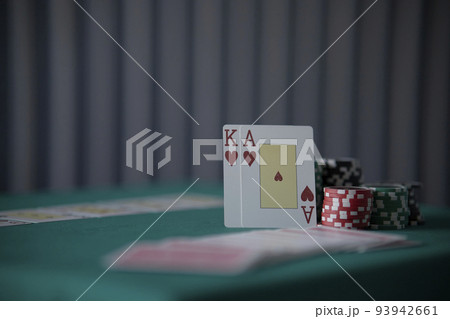 the poker game in casino chips cards and the poker table, winning combination in poker, flush royal 93942661