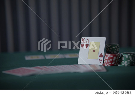 the poker game in casino chips cards and the poker table, winning combination in poker, flush royal 93942662
