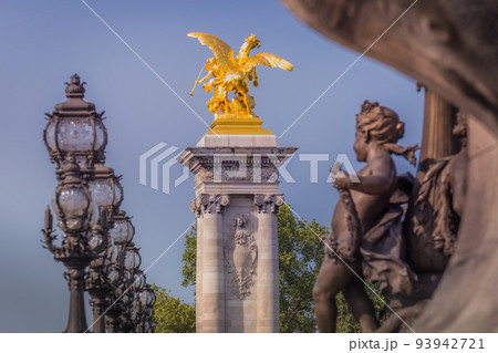 Line of Street lights and statues in Pont Alexandre III, Paris, france 93942721