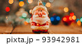 Christmas background with gift boxes, santa claus toy on wooden background with garland bokeh. Festive winter concept. Flat lay, copy space. photo banner 93942981