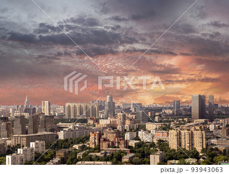 Aerial view of center of Moscow against the background of a romantic evening sky with clouds and rays of the sun, Russia 93943063