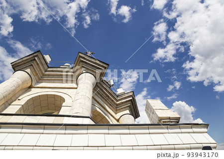 Fragment of the Radisson Collection Hotel (historical name Hotel Ukraina, made in Stalinist Empire style) against the background of the sky with clouds, Moscow, Russia 93943170
