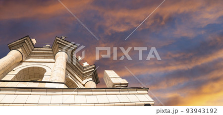 Fragment of the Radisson Collection Hotel (historical name Hotel Ukraina, made in Stalinist Empire style) against the background of the sky with clouds, Moscow, Russia Fragment of the Radisson Collection Hotel (historical name Hotel Ukraina, made in Stalinist Empire style) against the background of the sky with clouds, Moscow, Russia 93943192