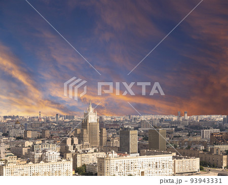 Aerial view of center of Moscow against the background of a romantic evening sky with clouds and rays of the sun (building Ministry of Foreign Affairs), Russia 93943331
