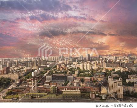Aerial view of center of Moscow against the background of a romantic evening sky with clouds and rays of the sun, Russia 93943530