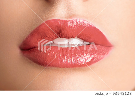 Close-up Beautiful lips. Sexy plump lips which lipstick. Close-up Beautiful lips. Sexy plump lips which lipstick. 93945128