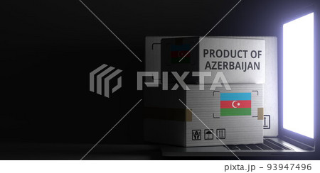 Cartons with PRODUCT OF AZERBAIJAN text and flag on the laptop, black background. 3D rendering 93947496