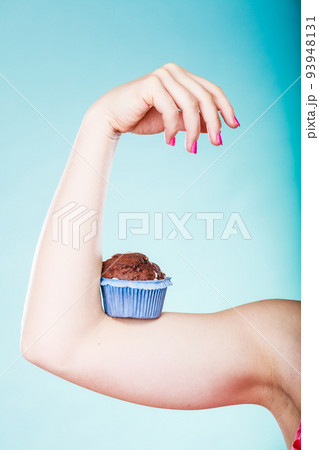 woman holds chocolate cake on arm woman holds chocolate cake on arm 93948131