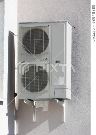 outdoor air conditioner unit with heat exchanger hanging outside the building outdoor air conditioner unit with heat exchanger hanging outside the building 93948889