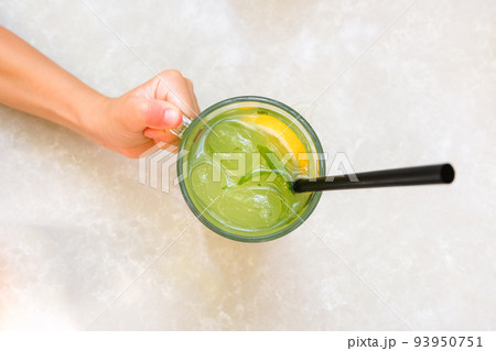 Fresh lemonade or mojito cocktail with mint on the table. 93950751