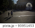 Girl 6 year with little brother 1-2 year old toddler boy having fun near fountain in Katowice 93951453