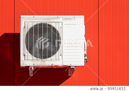 outdoor air conditioner unit on the wall of a building outdoor air conditioner unit on the wall of a building 93951652