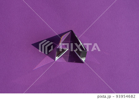Crystal prism refracting light, magic crystals and pyramid, sphere and cube on purple background. Spiritual healing crystal practice. Feng Shui, good energy flow concept.. Crystal prism refracting light, magic crystals and pyramid, sphere and cube on purple background. Spiritual healing crystal practice. Feng Shui, good energy flow concept.. 93954682