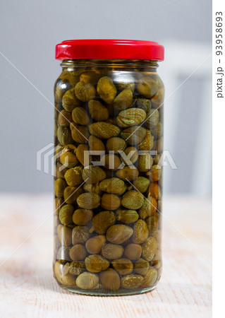 Glass jar with pickled capers Glass jar with pickled capers 93958693