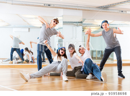 Teens hip hop dancers posing in studio Teens hip hop dancers posing in studio 93958698