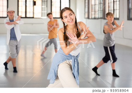 Teenage girl practicing active dance at studio Teenage girl practicing active dance at studio 93958904