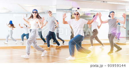 Boy and girls having dancing class 93959144