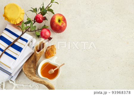 Rosh hashanah, jewish New Year holiday concept. Pomegranate, apples and honey traditional products for celebration 93968378