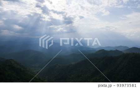 Top view Landscape of Morning Mist with Mountain Layer at north of Thailand. mountain ridge and clouds in rural jungle bush forest Top view Landscape of Morning Mist with Mountain Layer at north of Thailand. mountain ridge and clouds in rural jungle bush forest 93973581