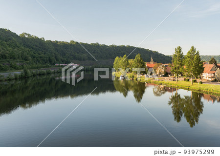 Necker River in morning light, water reflection, Neckar Valley, Baden-Wuerttemberg, Germany Necker River in morning light, water reflection, Neckar Valley, Baden-Wuerttemberg, Germany 93975299