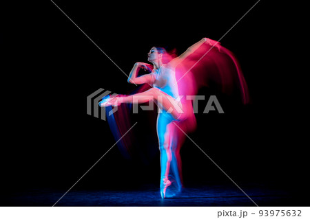 Flexible and beautiful girl, ballet dancer in motion over dark background in mixed neon light. Grace, art, flexibility, inspiration concept. 93975632