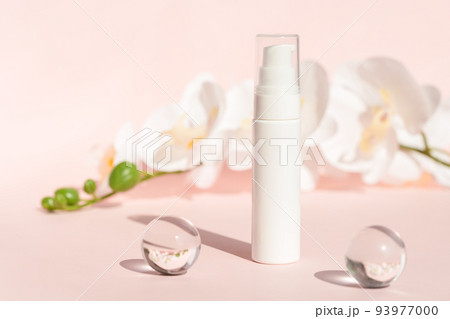 Cosmetics packaging, product branding, lotion, mask, cleanser container, cosmetic container on pastel background with flowers. Plastic cream bottle mockup on pink pedestal podium. 93977000