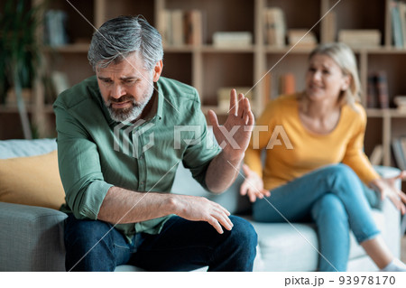 Relationship Problems. Portrait Of Middle Aged Spouses Arguing At Home Relationship Problems. Portrait Of Middle Aged Spouses Arguing At Home 93978170