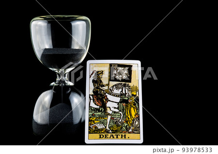 Hourglass with Death Tarot Card Isolated on a Black Background Hourglass with Death Tarot Card Isolated on a Black Background 93978533