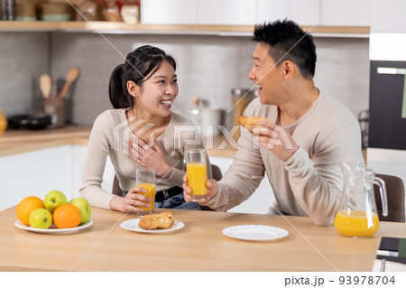 positive japanese spouses having fun while eating at kitchen positive japanese spouses having fun while eating at kitchen 93978704