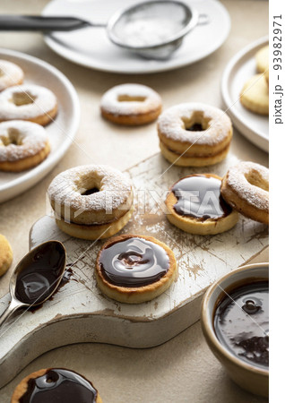 Cooking cookies process. Homemade linzer cookies with chocolate. Cooking cookies process. Homemade linzer cookies with chocolate. 93982971