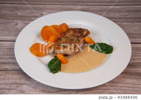 Recipe for baked lamb shoulder with watercress mashed, sweet potato and carrot, pepper sauce, cognac Recipe for baked lamb shoulder with watercress mashed, sweet potato and carrot, pepper sauce, cognac 93988406
