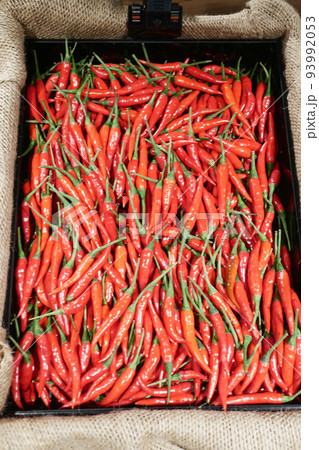 red chili pepper in large bowl in a retail shopping red chili pepper in large bowl in a retail shopping 93992053