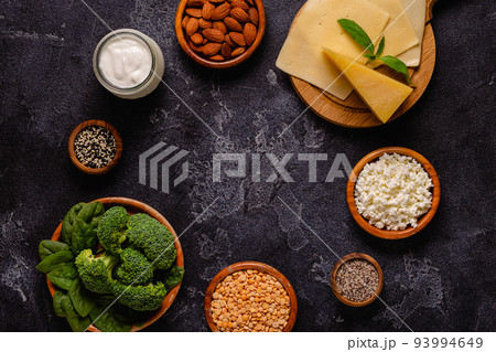 Products rich in calcium on dark background. 93994649