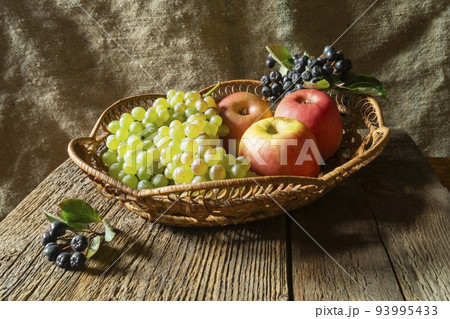Ripe fruits and berries on a wooden table Ripe fruits and berries on a wooden table 93995433