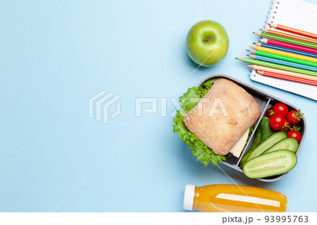 Lunch box with sandwich, vegetables and juice 93995763