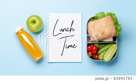 Lunch box with sandwich, vegetables and juice 93995765