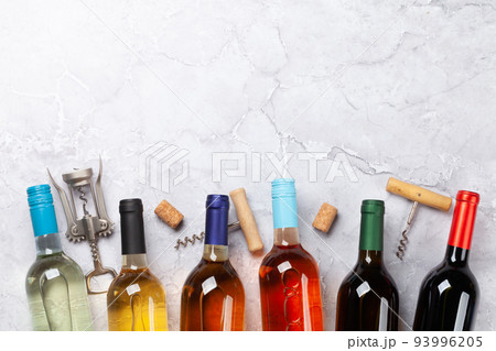Various wine bottles and corkscrews Various wine bottles and corkscrews 93996205