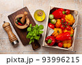 Various colorful garden tomatoes and bell peppers 93996215