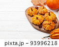 Pumpkin muffins and various pumpkins 93996218