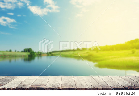 Wooden table with summer bokeh 93996224