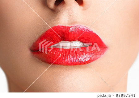 Close-up Beautiful lips. Sexy plump lips which red lipstick. 93997541
