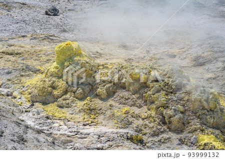smoking solfatara in a fumarole field on the slope of the Mendeleev volcano smoking solfatara in a fumarole field on the slope of the Mendeleev volcano 93999132