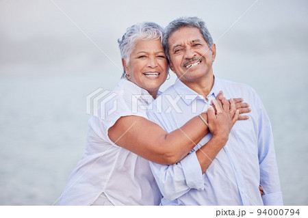 Senior love, hug and portrait couple on beach in trust hug, security and safety on retirement holiday, vacation or break. Happy couple, people smile and elderly man and woman bonding close together Senior love, hug and portrait couple on beach in trust hug, security and safety on retirement holiday, vacation or break. Happy couple, people smile and elderly man and woman bonding close together 94000794