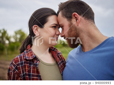 Love, freedom and happy couple in countryside, nature park or farm with field growth in spring environment. Man, woman and romance on a relax, sustainability and agriculture farmer date Love, freedom and happy couple in countryside, nature park or farm with field growth in spring environment. Man, woman and romance on a relax, sustainability and agriculture farmer date 94000993
