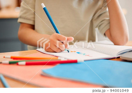 Student drawing picture in book, learning math and doing calculations in a notebook for education in a classroom at school. Little child writing, being creative with numbers and studying in class Student drawing picture in book, learning math and doing calculations in a notebook for education in a classroom at school. Little child writing, being creative with numbers and studying in class 94001049