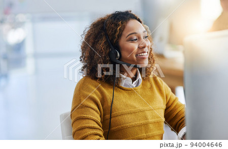 Dont forget to smile. Shot of a female agent working in a call centre. Dont forget to smile. Shot of a female agent working in a call centre. 94004646