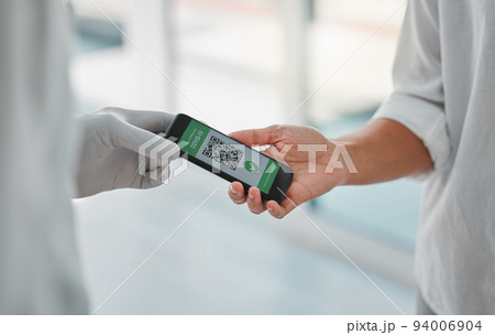 Covid vaccine passport, digital qr code certificate and travel pass on phone screen for health, virus and security clearance. Tourist and airport immigration with mobile app for medical safety data 94006904
