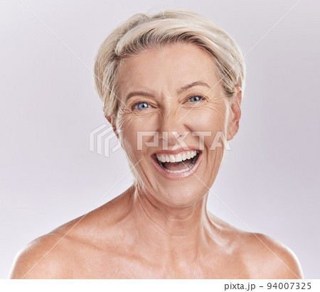 Skincare, wellness and face of senior woman with big smile in beauty, cosmetics or makeup portrait isolated on a studio background. Happy old lady or model with flawless anti aging skin care 94007325